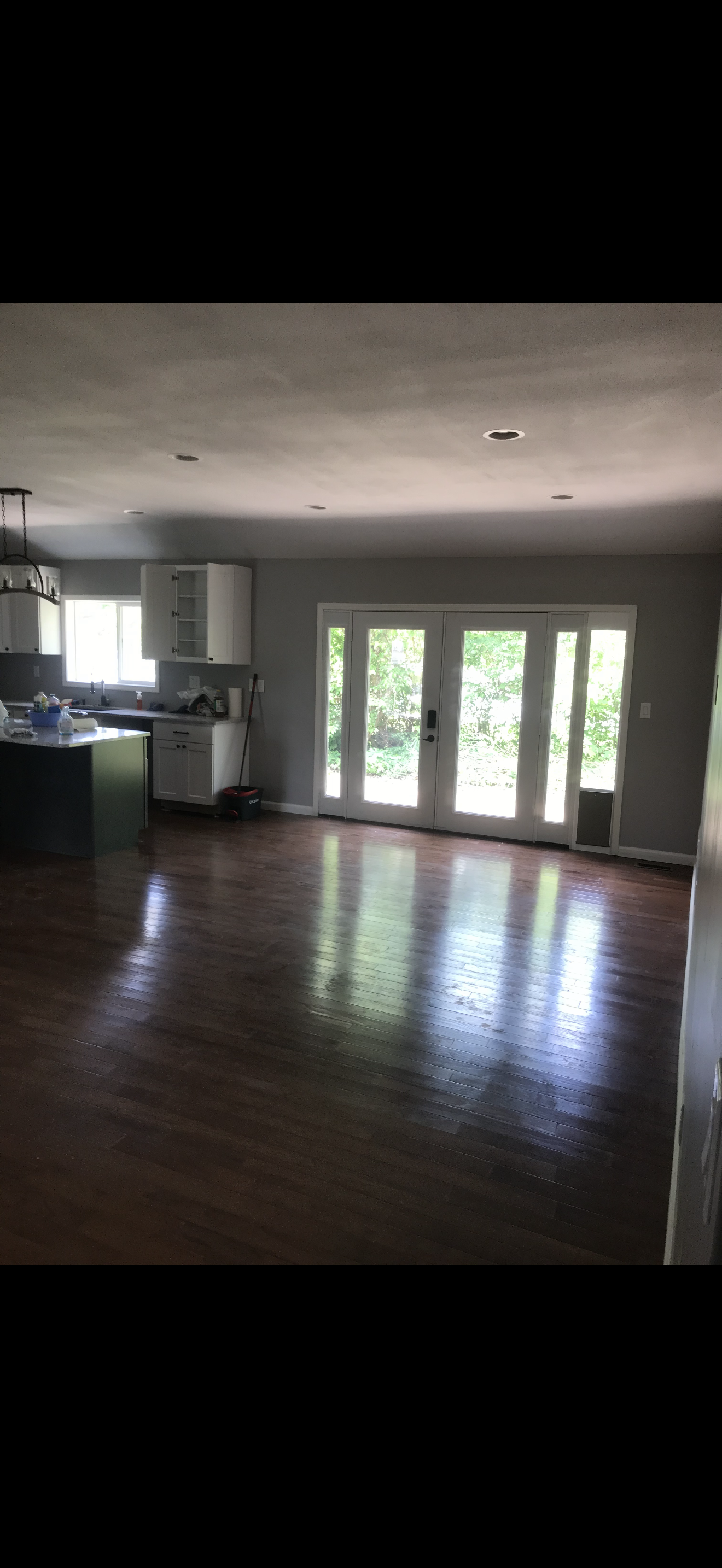 Flooring replacement: new flooring installed with clean transitions and updated base trim.